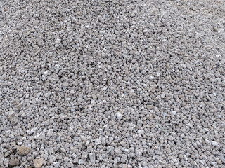 Gravel, natural texture, construction material, gray tones, copy space.