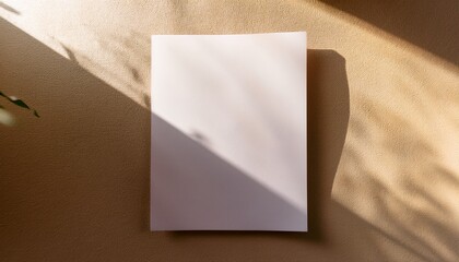 blank paper glued to the beige sunlit wall abstract mockup design
