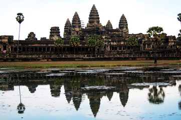 Naklejka premium Ancient ruins antique building castle Khmer Empire of Angkor Wat for cambodian people and foreign travelers travel visit respect praying in largest religious temple city complex in Siem Reap, Cambodia