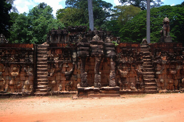 Naklejka premium Sculpture carving story khmer Empire on wall in Prasat Ta Prohm or Ancestor Brahma temple of Angkor Thom Wat for cambodian people foreign travelers travel visit at Siemreap city in Siem Reap, Cambodia