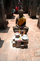 Naklejka premium Buddha god statue of Prasat Bayon Castle or Jayagiri Brahma Temple for cambodian people and foreign travelers travel visit respect praying at Angkor Thom Wat on April 12, 2009 in Siem Reap, Cambodia