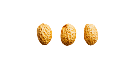 Three Golden Peanuts isolated on Black Background, cut out transparent