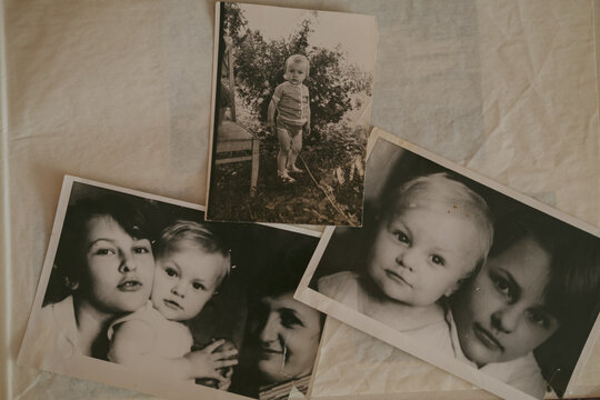 A vintage heartfelt photo of a loving brother and sister, in soft sepia, black and white tones. An old, slightly yellowed retro photo taken in the USSR around the 1980s-1990s.