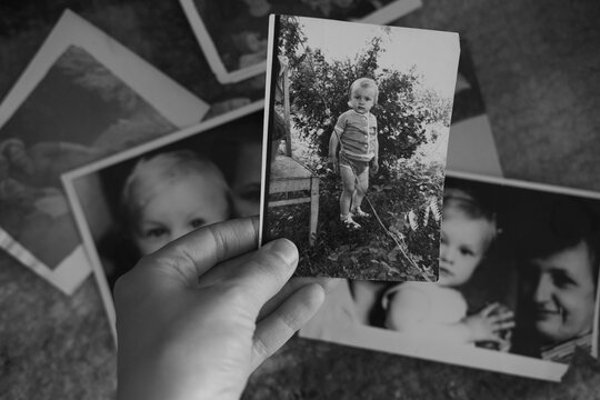 A vintage heartfelt photo of a loving brother and sister, in soft sepia, black and white tones. An old, slightly yellowed retro photo taken in the USSR around the 1980s-1990s. - Powered by Adobe