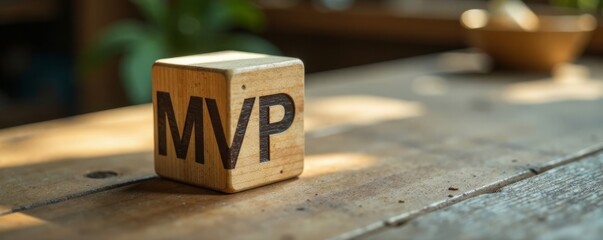 Wooden cube MVP icon on a wooden table with build and measure icons nearby, start up, innovation