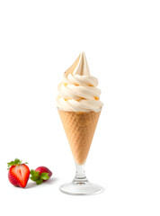A refreshing vanilla soft serve ice cream in a waffle cone, with strawberries to the side.