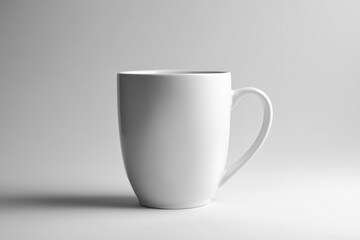 A Clean White Ceramic Mug with a Curved Handle Is Shown