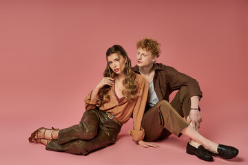 Vibrant couple showcasing modern fashion in a playful moment of connection and style