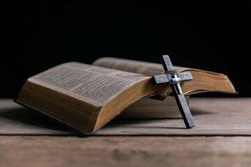 Religious belief concept Close up prayer Christian church service Bible Holy cross Spiritual power Blurred background Desk copy space Heaven God Catholic faith Praise book Jesus worship Gospel symbols