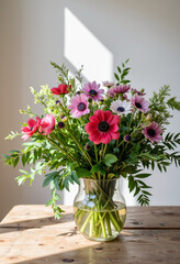 Vibrant bouquet of anemones on rustic table, floral elegance