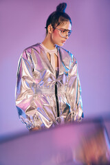 Futuristic fashion blends vibrant holographic colors with stylish attire on a beautiful woman