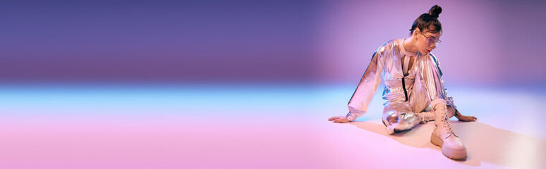 Stylish woman embracing vibrant holographic fashion in a futuristic setting