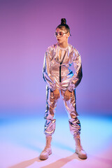 Stylish woman embodies futuristic fashion with holographic hues in modern ambiance