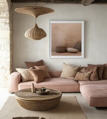 Relaxed living room with pink sofa, earthy tones, woven lamp, and artwork.