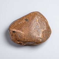 Fototapeta premium Close Up of a Light Brown Pebble on White Background