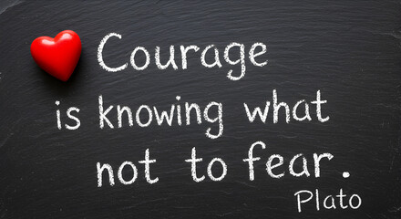 Inspirational Quote on a Chalkboard with Red Heart Symbolizing Courage and Wisdom