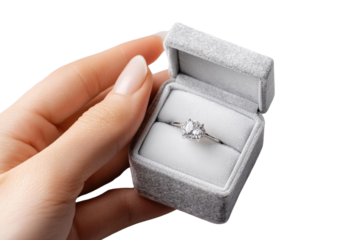 Delicate hand gently presenting a small jewelry box with soft velvet texture a romantic gesture for a special occasion like an engagement anniversary or proposal