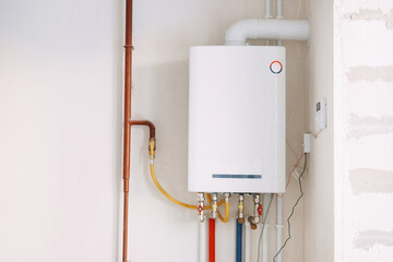 Installation of a gas boiler with colored pipes equipped with valves and connectors for efficient...