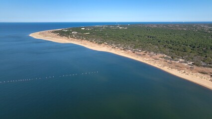 Beautiful sandy beach and nature preserve suitable for camping outdoors at Virginia Beach, VA and relaxing beside peaceful water under warm sunlight