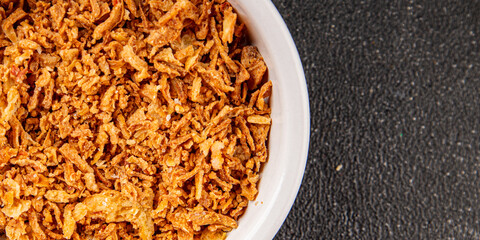 Fried onion crispy onions appetizer vegetables dish fresh delicious gourmet food background on table rustic food top view copy space vegetarian and vegan food