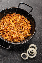 Fried onion crispy onions appetizer vegetables dish fresh delicious gourmet food background on table rustic food top view copy space vegetarian and vegan food