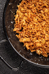Fried onion crispy onions appetizer vegetables dish fresh delicious gourmet food background on table rustic food top view copy space vegetarian and vegan food