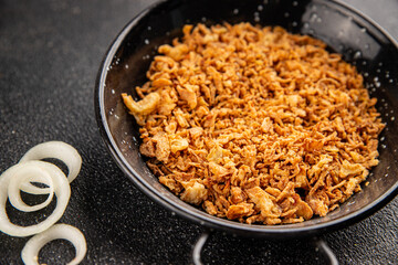 Fried onion crispy onions appetizer vegetables dish fresh delicious gourmet food background on table rustic food top view copy space vegetarian and vegan food