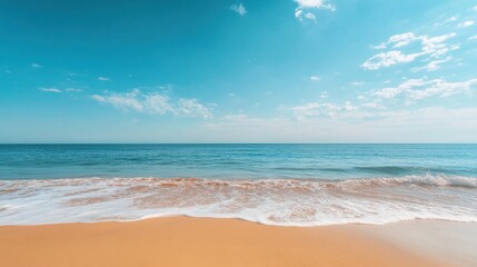 Obraz premium Serene Beachscape: Capturing a tranquil beach scene, with the sky merging seamlessly with the ocean, creating a sense of peace and vastness.