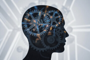A conceptual photograph of a human head
silhouette with intricate gear mechanisms inside.