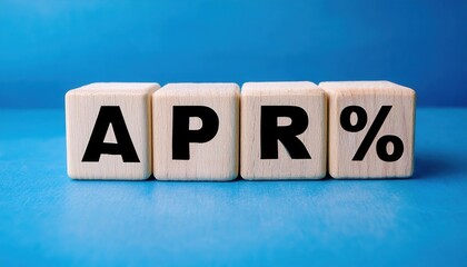 Wooden blocks displaying the term APR% on a vibrant blue background.