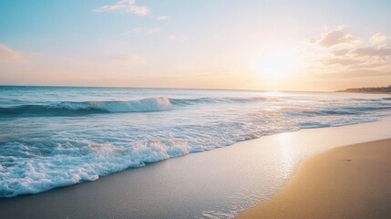 Obraz premium Coastal Serenity: Golden sunlight bathes a pristine sandy beach and the turquoise waves of the sea. Experience the calming rhythm of nature at its finest.