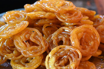 Jalebi sweets. It is a popular sweet snack in India subcontinent. It is many...