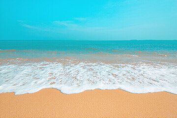 Fototapeta premium Beautiful blue ocean wave with sand beach background