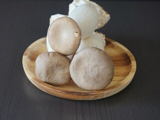 Mushroom on a dark background, cooking. Asian cuisine. 새송이 버섯.