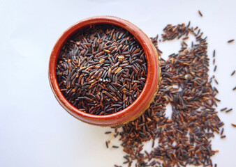 Close-up, Top view uncooked Thai riceberry or black rice is highly nutritious .
