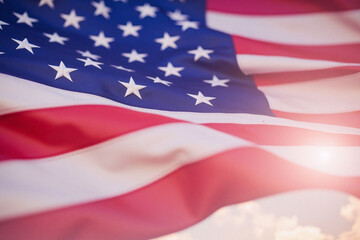 american flag with a blue sky in the background