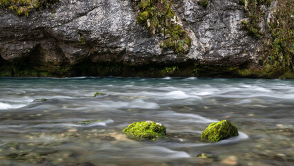 River flow under rocky cliff, detail from mountain river Dabar near Sanski Most