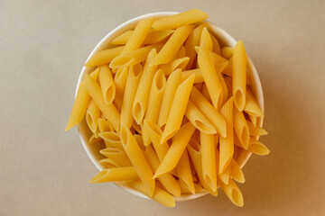 Delicious uncooked penne pasta ready for culinary adventures in the kitchen