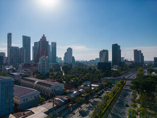Aerial view modern office building with tropical green tree park in Benchakitti public park downtown