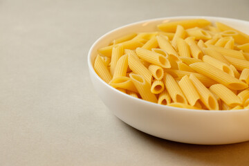 Creative presentation of penne pasta ready for culinary exploration at home