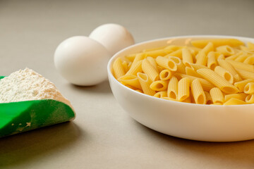 Culinary preparations for a delightful homemade pasta dish in a cozy kitchen
