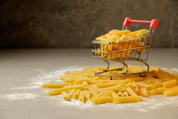 Pasta cart overflowing with delicious penne on the kitchen counter