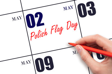 May 2. Hand writing text Polish Flag Day on calendar date. Save the date.