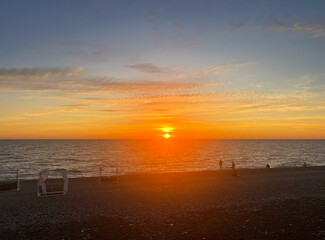 Red sun setting over the sea