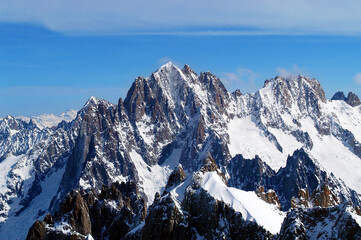 Sharp mountains in the glacier of the Valle Blanche photographed from the Aiguille du Midi at the foot of Mont Blanc