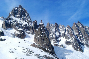 Sharp mountains in the glacier of the Valle Blanche photographed from the Aiguille du Midi at the foot of Mont Blanc