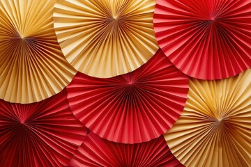 Festive paper fans, layered in gold and red