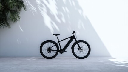 Fototapeta premium Sleek black bike stands out against minimalistic white backgroun