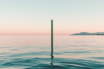 The peaceful view of the river Clyde, surrounded by mountains, at sunset on a summer evening is a serene scene that promotes mindfulness and meditation in Scotland, UK