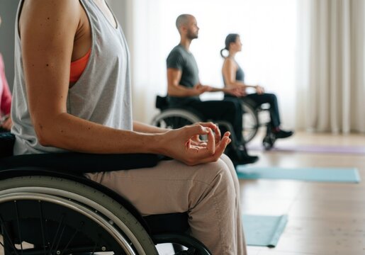 Yoga class practicing meditation, demonstrating inclusivity and promoting physical and mental wellbeing for people with disabilities